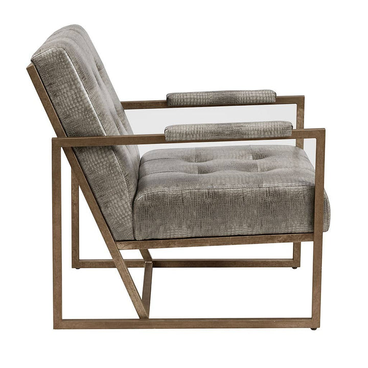 Chic Collective grey snakeskin PU leather accent chair with tufted seat and antique bronze metal frame.