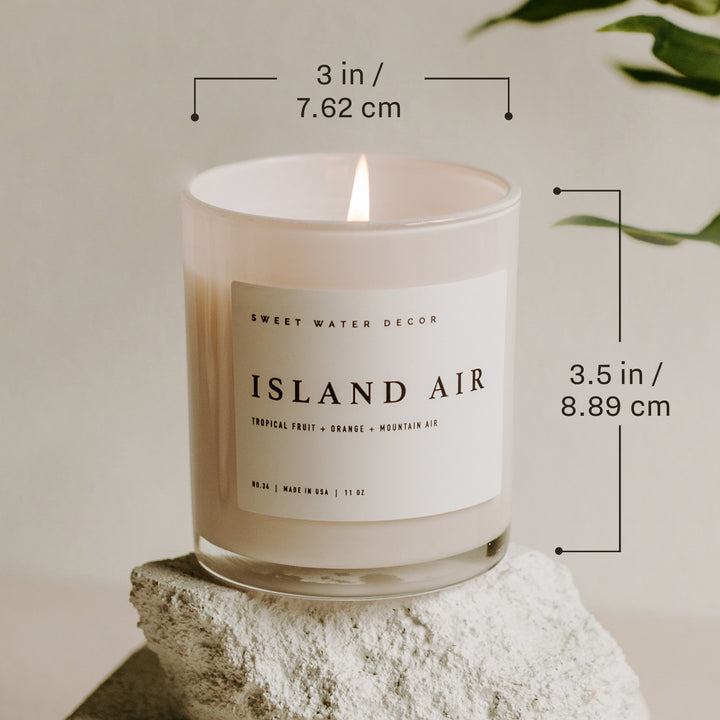 Chic Collective white jar candle with Island Air scent, 11 oz soy wax blend, 3" diameter, 3.5" height.