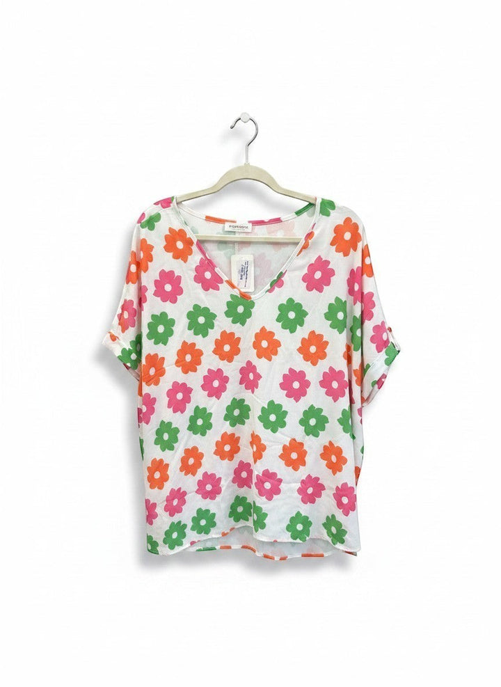 Chic Collective ivory white dolman top with a repeating floral print in coral, green, and pink.