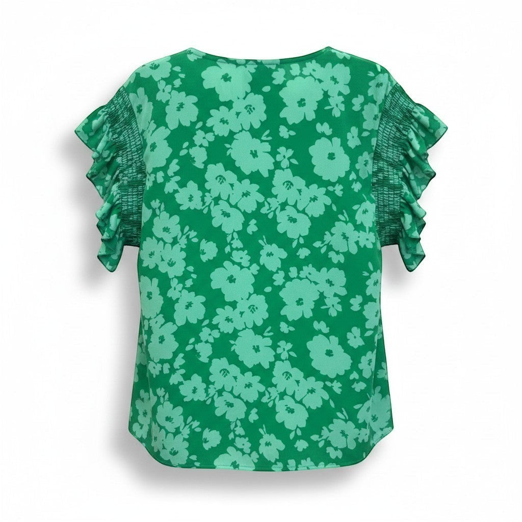 Chic Collective Kelly green woven blouse with smocked frilly sleeves and a light green floral print.
