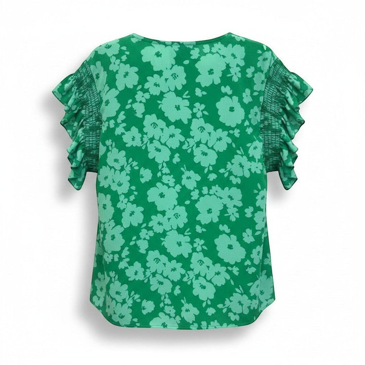 Chic Collective Kelly green woven blouse with smocked frilly sleeves and a light green floral print.