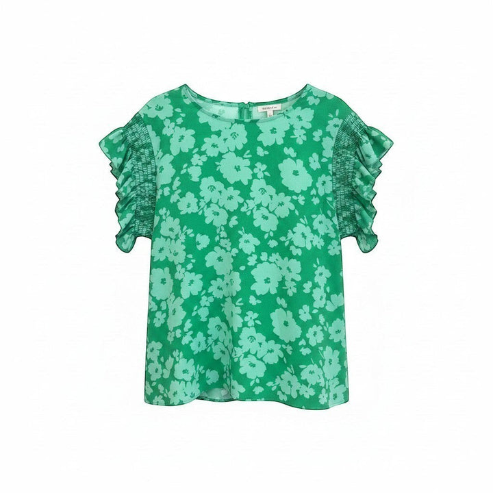 Chic Collective Kelly green woven blouse with a floral print, smocked short sleeves, and frilly cuffs.