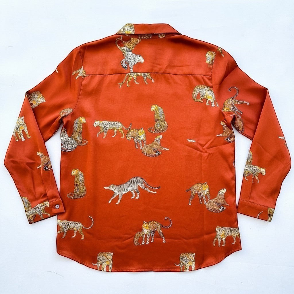 Chic Collective burnt orange satin long-sleeve shirt with an all-over leopard print pattern.
