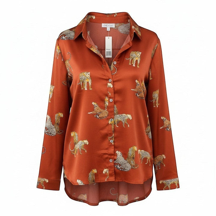 Chic Collective rust orange satin long-sleeve button-up shirt with an all-over leopard print.
