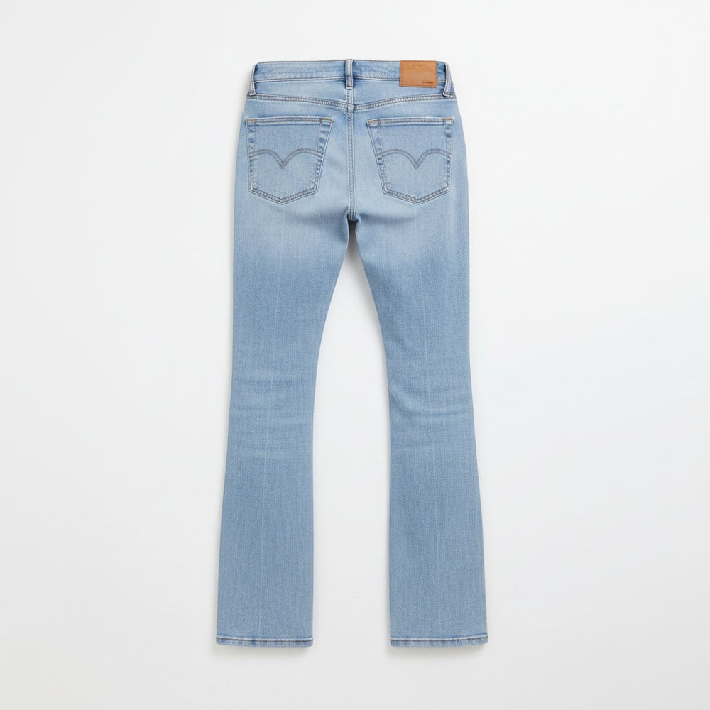 Chic Collective Risen Mid Rise Frayed jeans in light blue denim with a flared leg and distressed hem. Size 13.