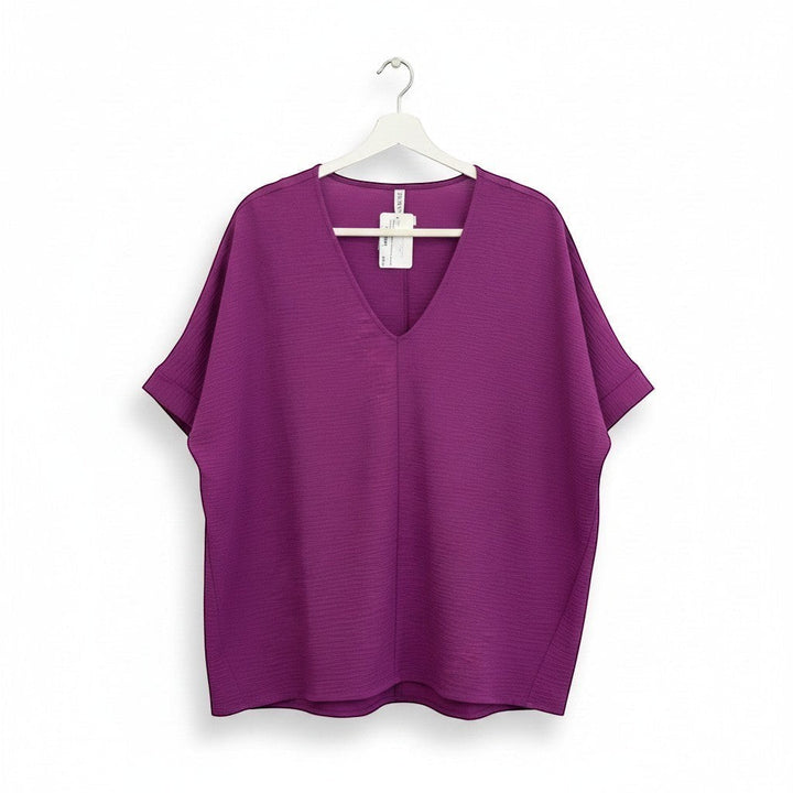 Chic Collective light plum woven dolman top with V-neck and short sleeves, perfect for versatile styling.