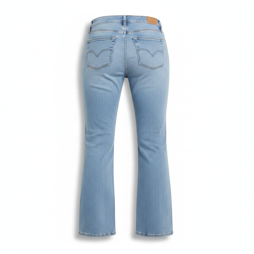 Chic Collective Risen Mid Rise Frayed light wash denim flare jeans with classic five-pocket styling and a leather brand patch.