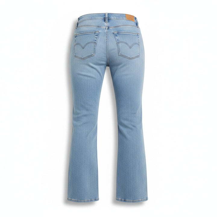 Chic Collective Risen Mid Rise Frayed light wash denim flare jeans with classic five-pocket styling and a leather brand patch.