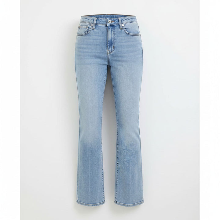 Chic Collective Risen Mid Rise Frayed light wash denim jeans with a slight flare and raw hem.