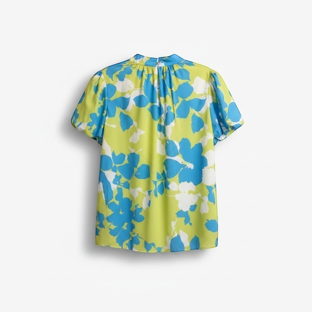 Chic Collective lime green and blue floral print blouse with short sleeves and a bow back detail.