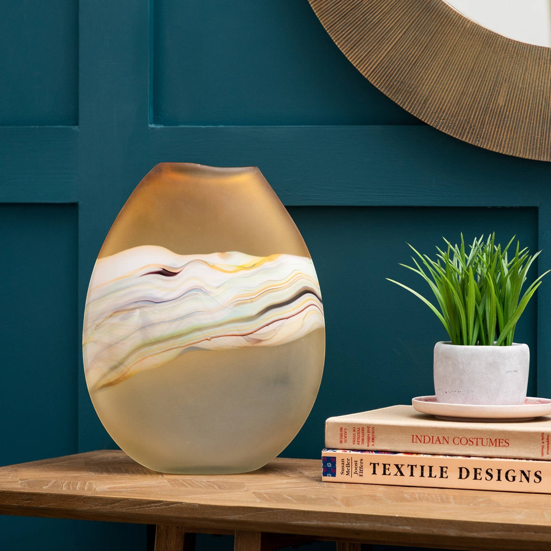 Chic Collective Lucius hand-blown frosted glass vase with a citrine-toned top and a swirling rainbow pattern on the body.