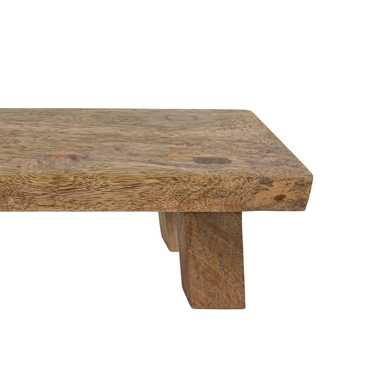 Chic Collective Hazel footed stool made of natural mango wood, perfect for serving or decor.