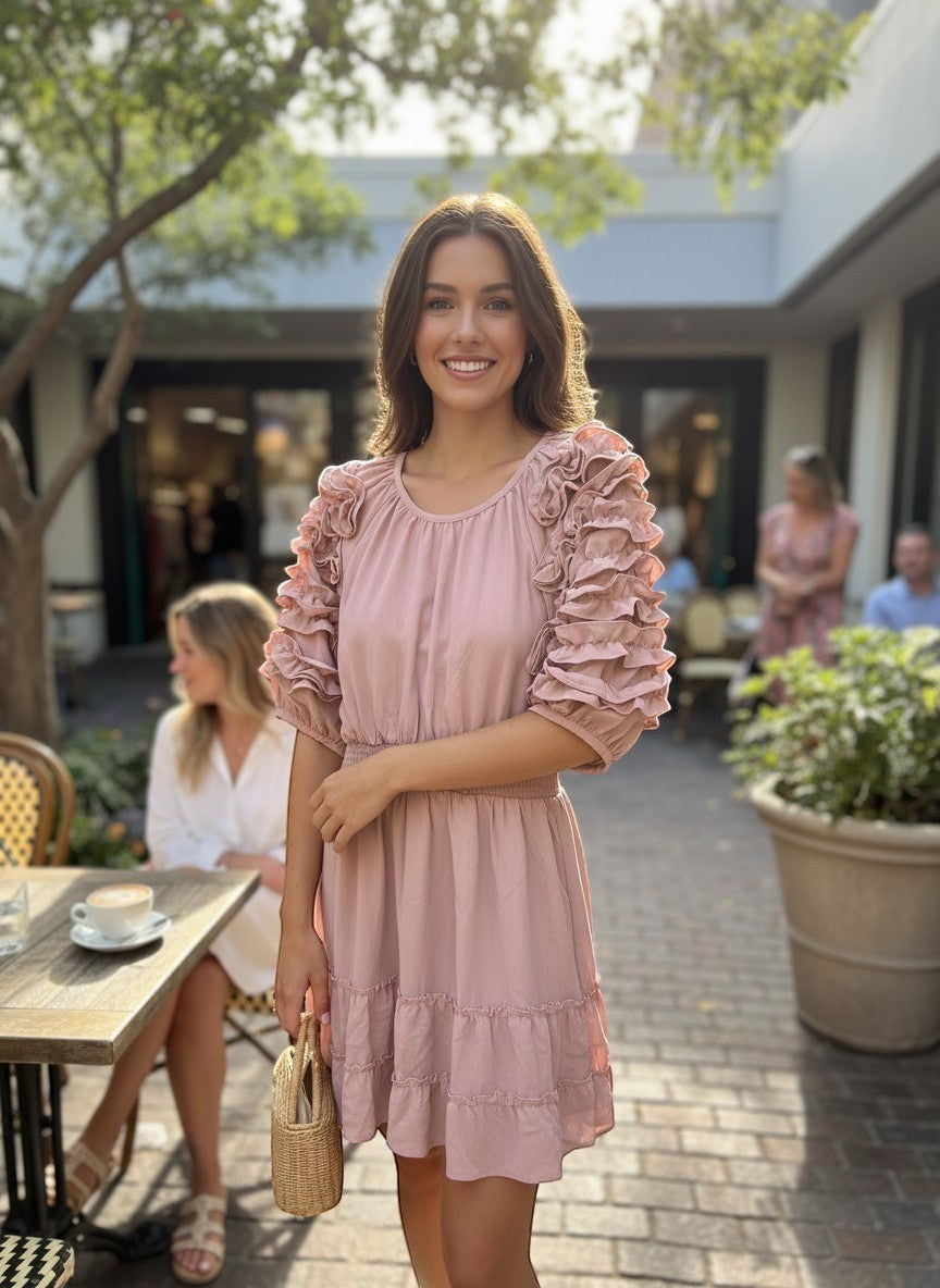 Chic Collective mauve dress with ruffled sleeves, ruched waist, and tiered hem. Model outdoors.