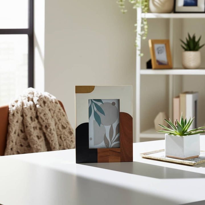 Chic Collective multicolor resin mid-century photo frame with abstract design in ivory, brown, and gold.