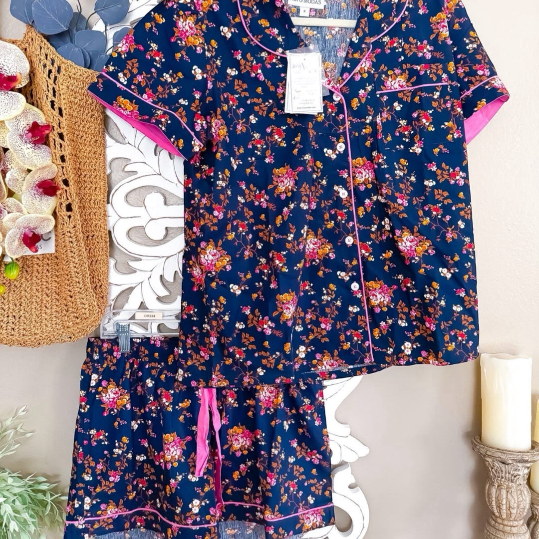 Chic Collective navy blue floral print pajama set with pink trim. Short sleeve top and shorts.