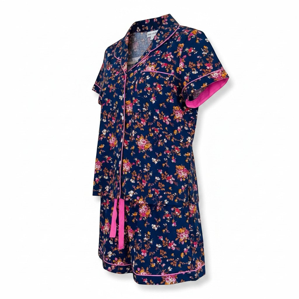 Chic Collective navy blue floral print short pajama set with pink trim and tie waist. Short sleeves and shorts.