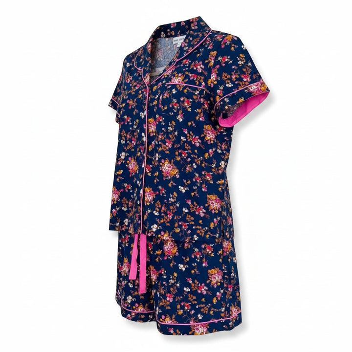 Chic Collective navy blue floral print short pajama set with pink trim and tie waist. Short sleeves and shorts.