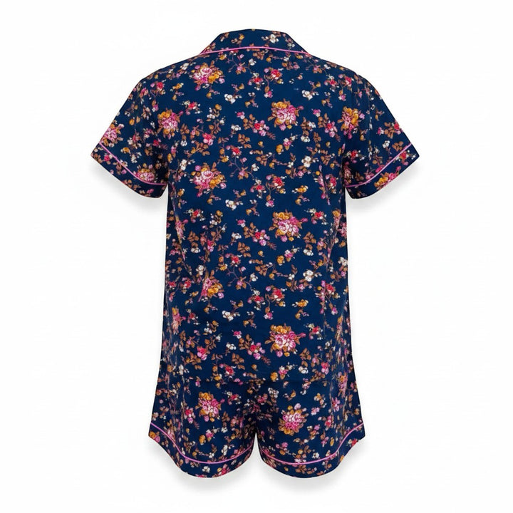 Chic Collective navy blue floral print short pajama set with pink trim. Short sleeves, collared neckline, and shorts.