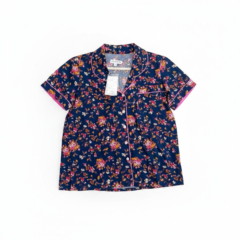 Chic Collective navy blue short sleeve pajama top with pink trim and a vibrant floral print.