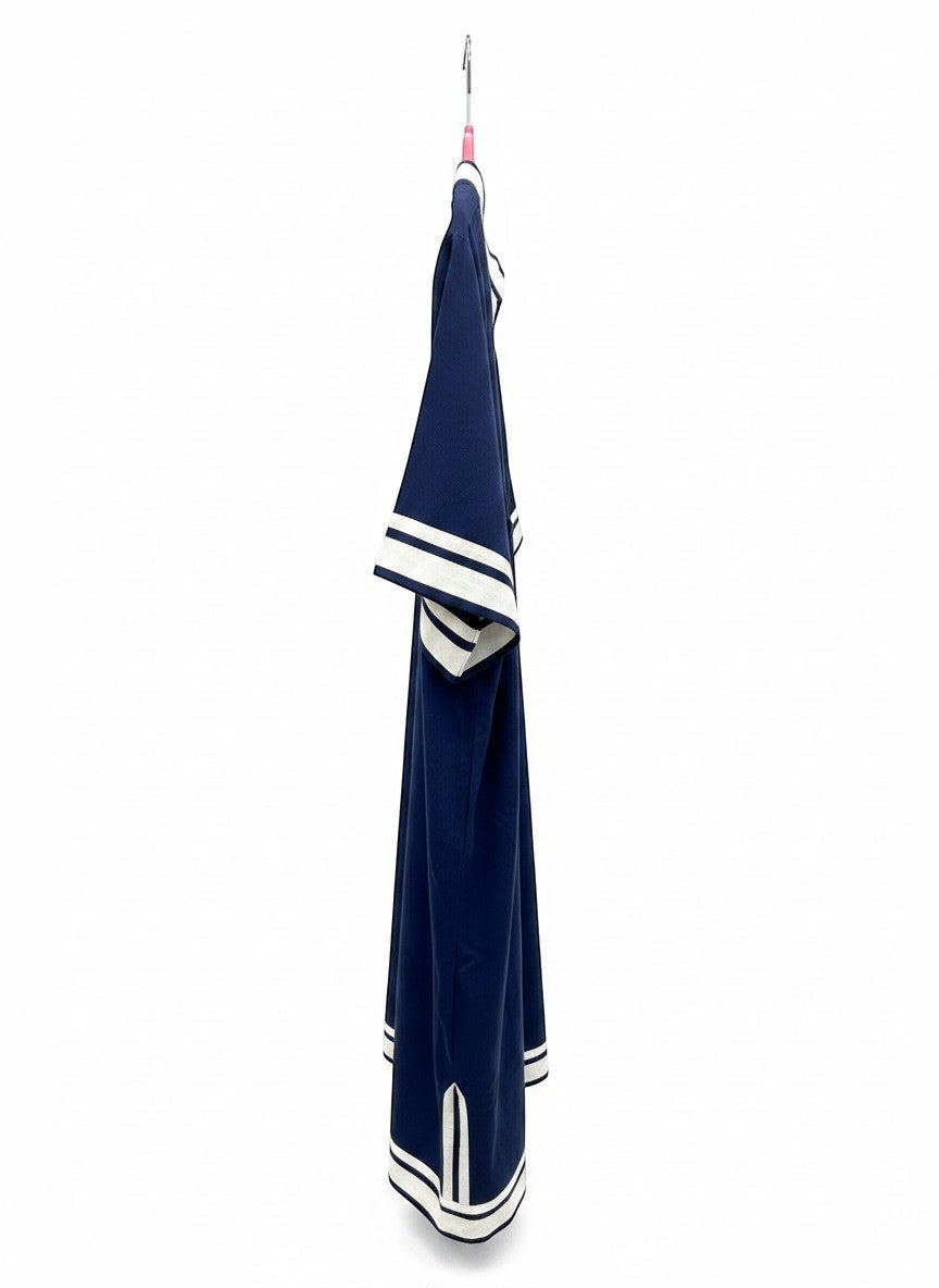 Chic Collective navy blue tunic dress with white trim on V-neck, sleeves, and hem. Relaxed fit, ideal for casual wear or beach cover-up.