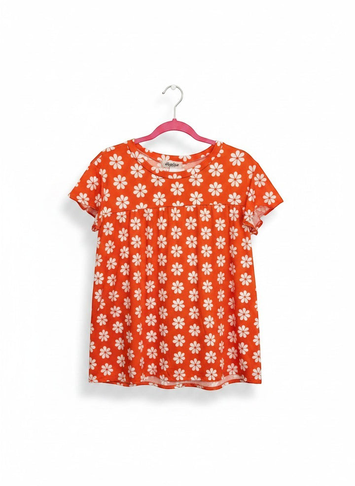 Chic Collective orange babydoll top with white daisy print and flutter sleeves.