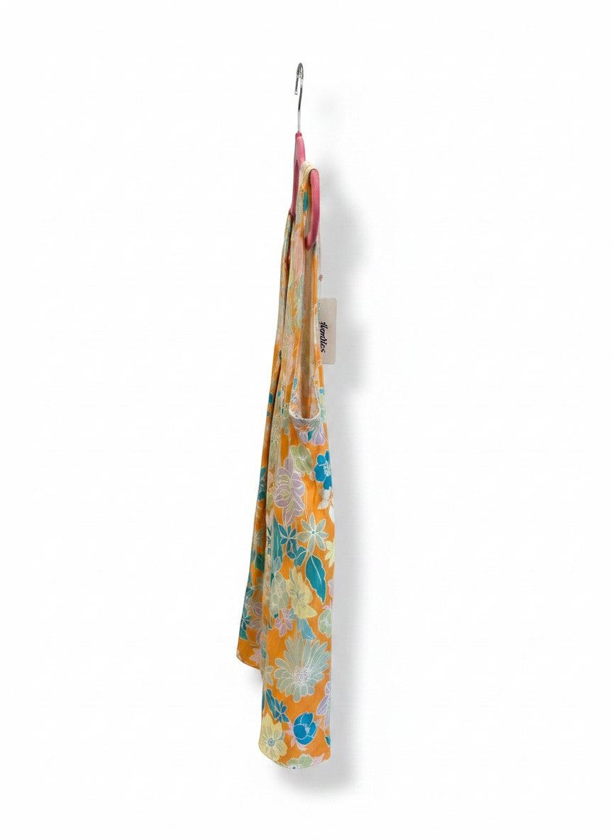 Chic Collective orange floral print sleeveless V-neck top with blue, pink, and yellow flowers. Lightweight fabric.