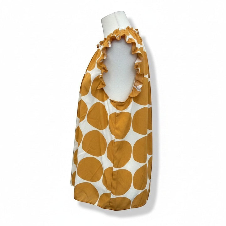 Chic Collective orange and ivory big polka dot ruffle blouse with a sleeveless design and ruffled neckline.