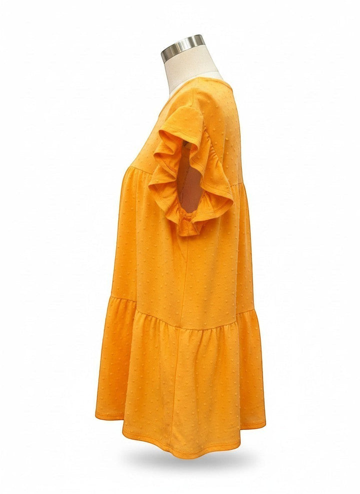 Chic Collective orange peach swiss dot tiered top with ruffled cap sleeves and round neck.