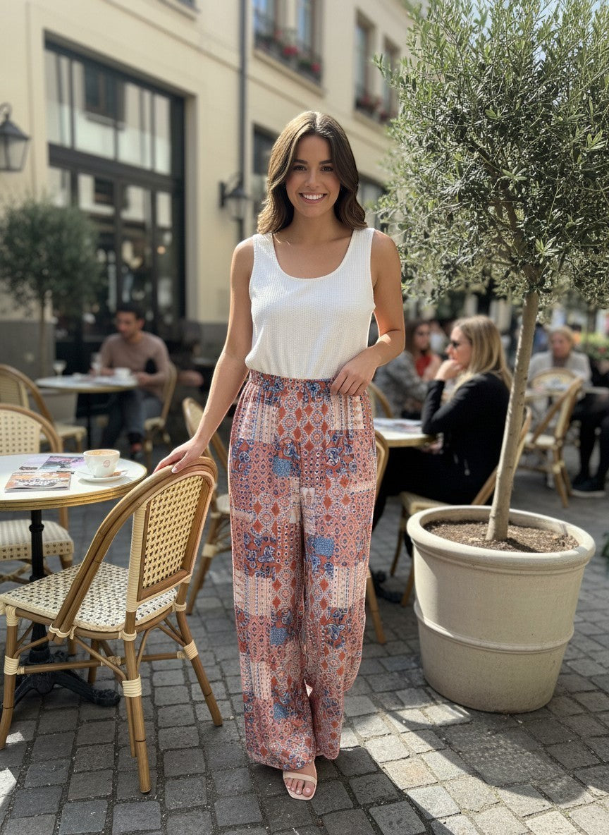 Chic Collective ivory coral vintage patchwork knit jumpsuit with a white ribbed tank top.