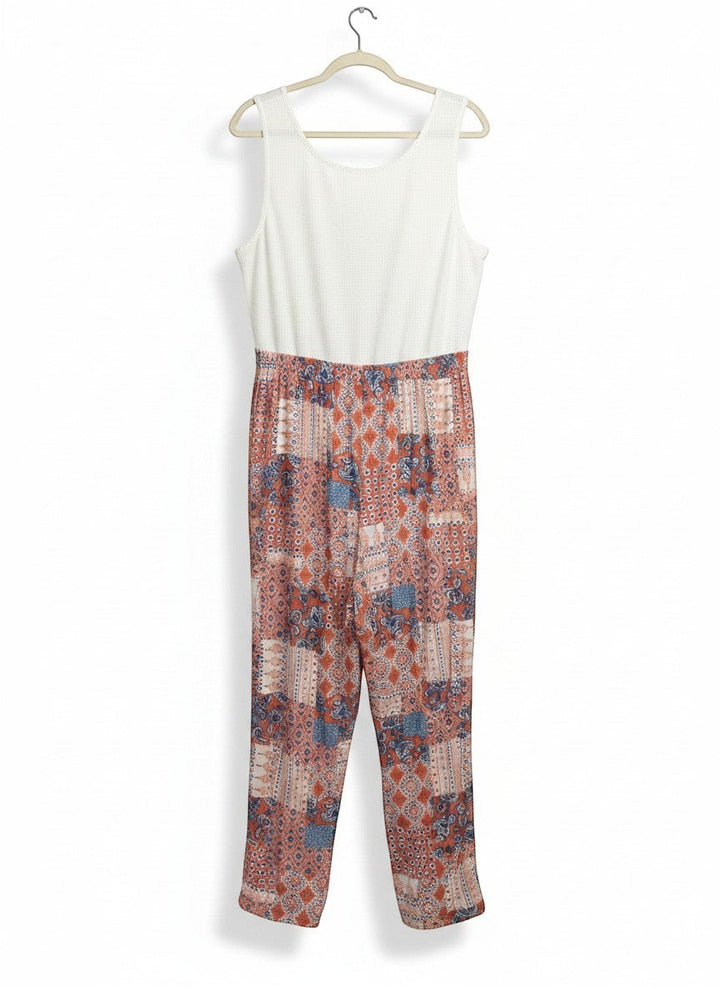 Chic Collective ivory coral vintage patchwork knit jumpsuit with a textured white sleeveless top and patterned pants.