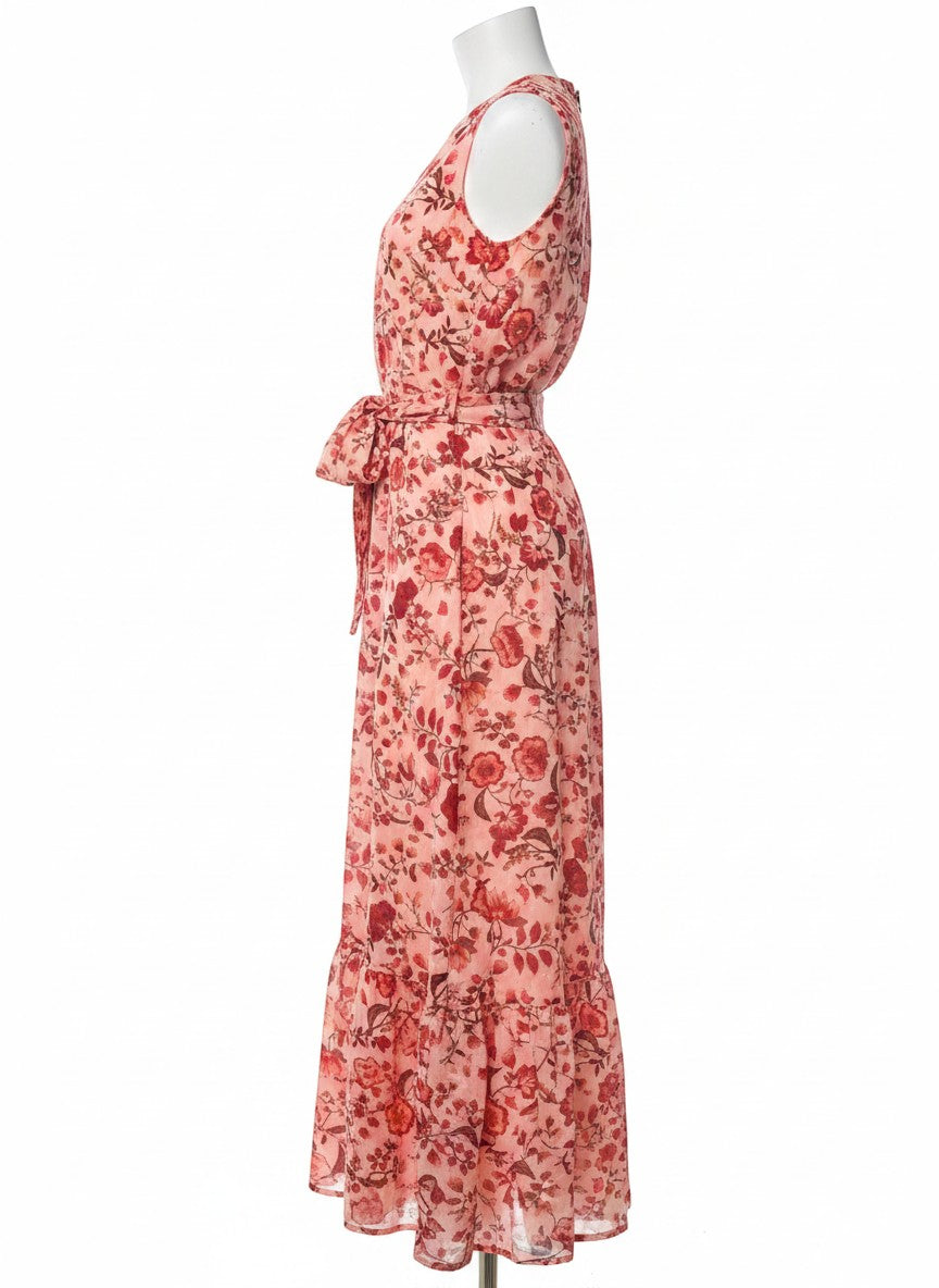 Chic Collective peachy pink maxi dress with red floral print, V-neck, sleeveless, and tie waist. Ruffled hem.