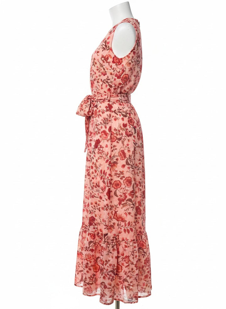 Chic Collective peachy pink maxi dress with red floral print, V-neck, sleeveless, and tie waist. Ruffled hem.