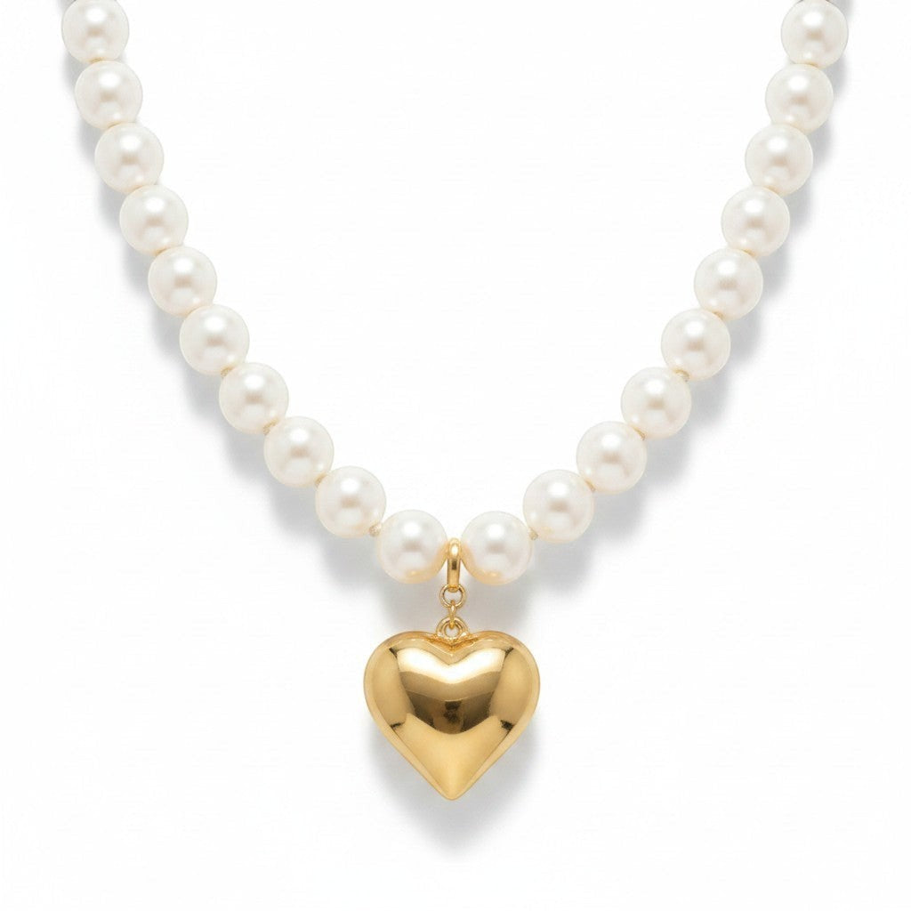 Chic Collective white pearl necklace with a gold-tone heart charm pendant.
