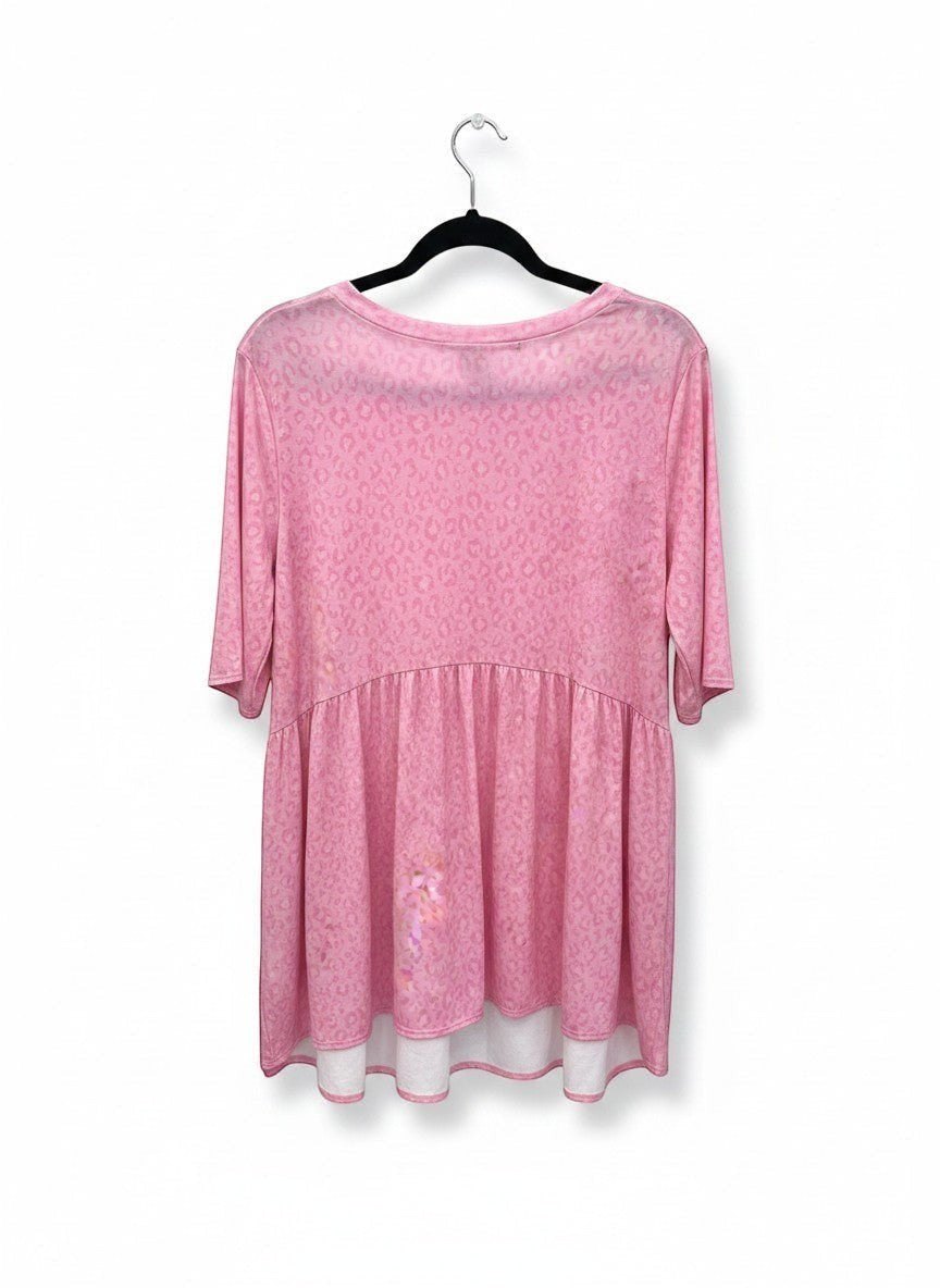 Chic Collective soft pink animal print babydoll top with short sleeves and a tiered hem.