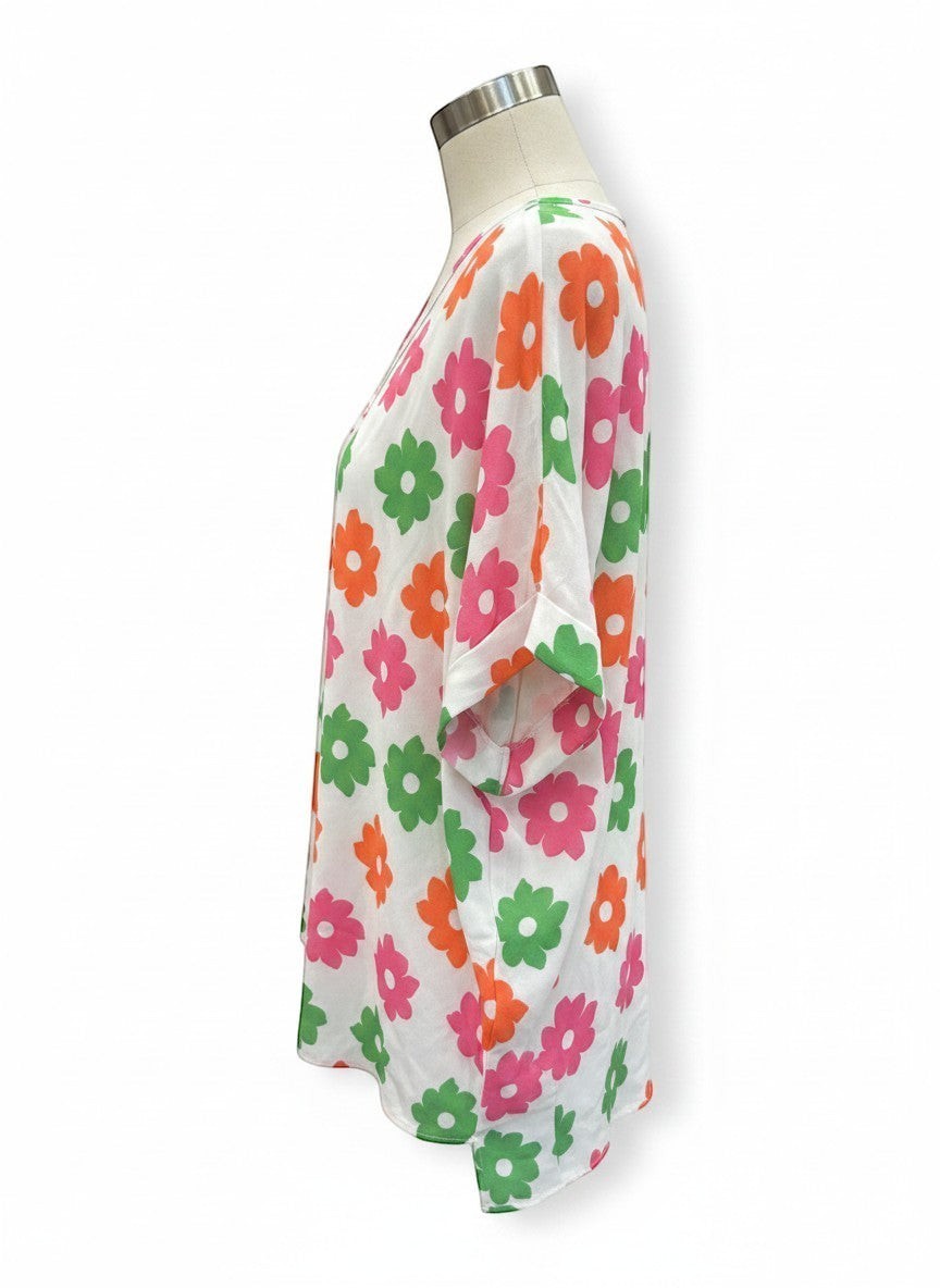 Chic Collective Ivory Coral Green Pink Floral Dolman Top. Short-sleeved, lightweight top with a vibrant floral print.