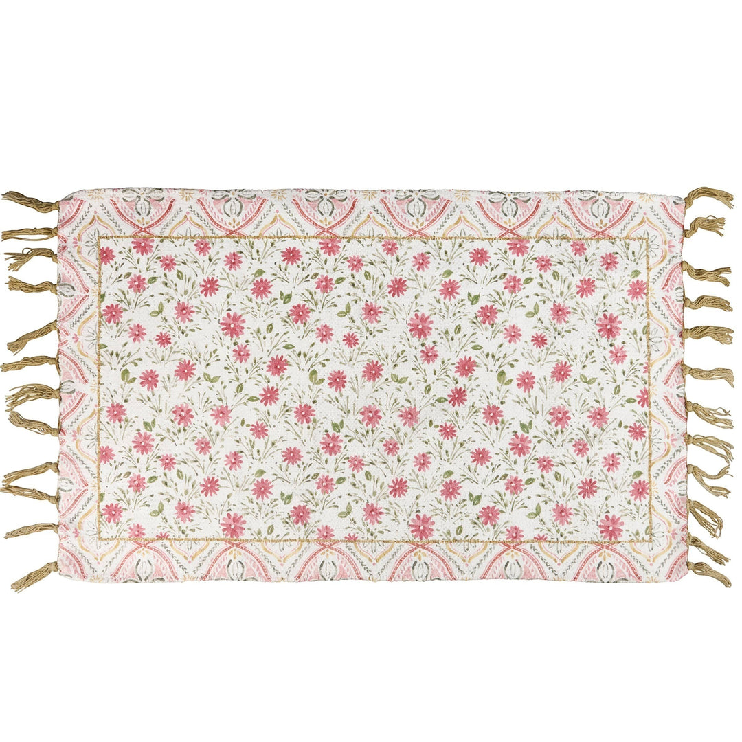 Chic Collective pink floral cotton and chenille rug with tasseled edges and decorative border. Watercolor-style floral pattern.