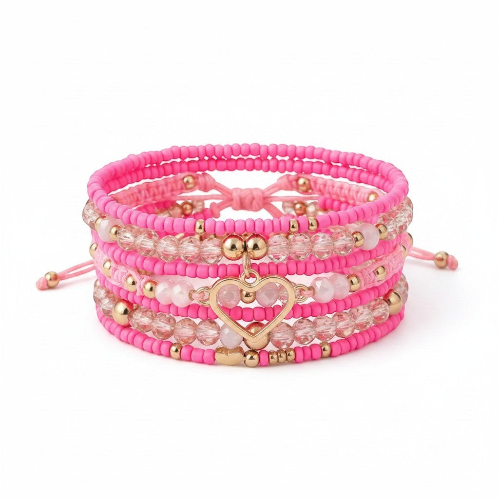 Chic Collective Pink Heart Stack bracelet set with pink beads, gold accents, and a gold heart charm.