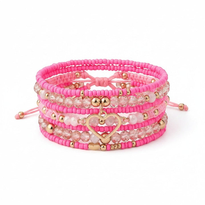 Chic Collective Pink Heart Stack bracelet set with pink beads, gold accents, and a gold heart charm.