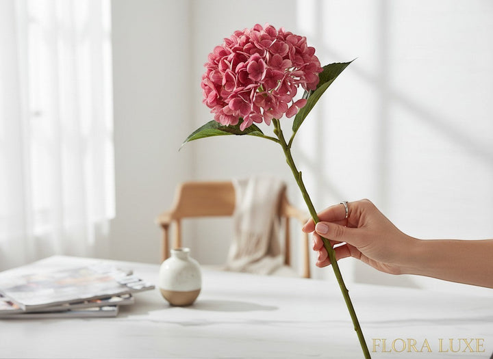 Chic Collective pink real touch hydrangea stem with green leaves, 18.5" long, perfect for arrangements.