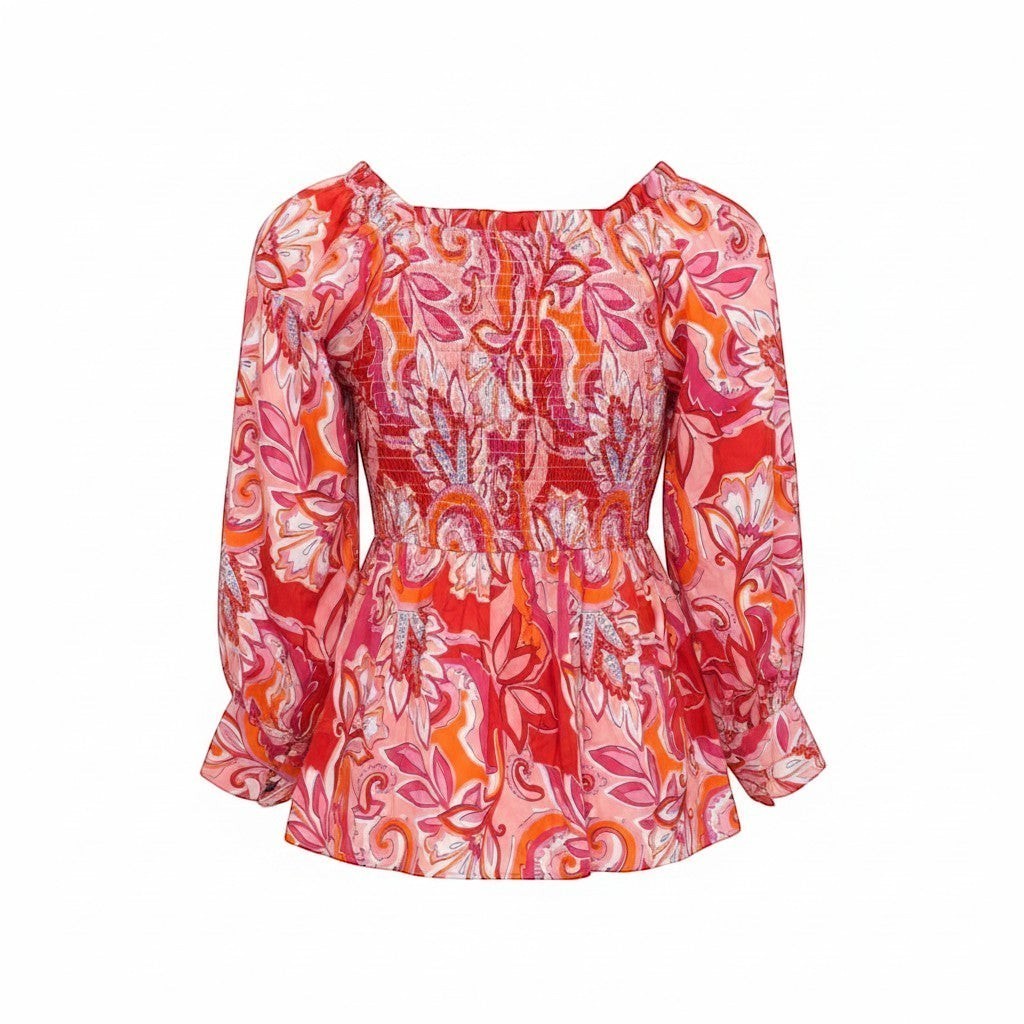 Chic Collective babydoll top with pink, red, and orange paisley print. Features smocked bodice and puff sleeves.