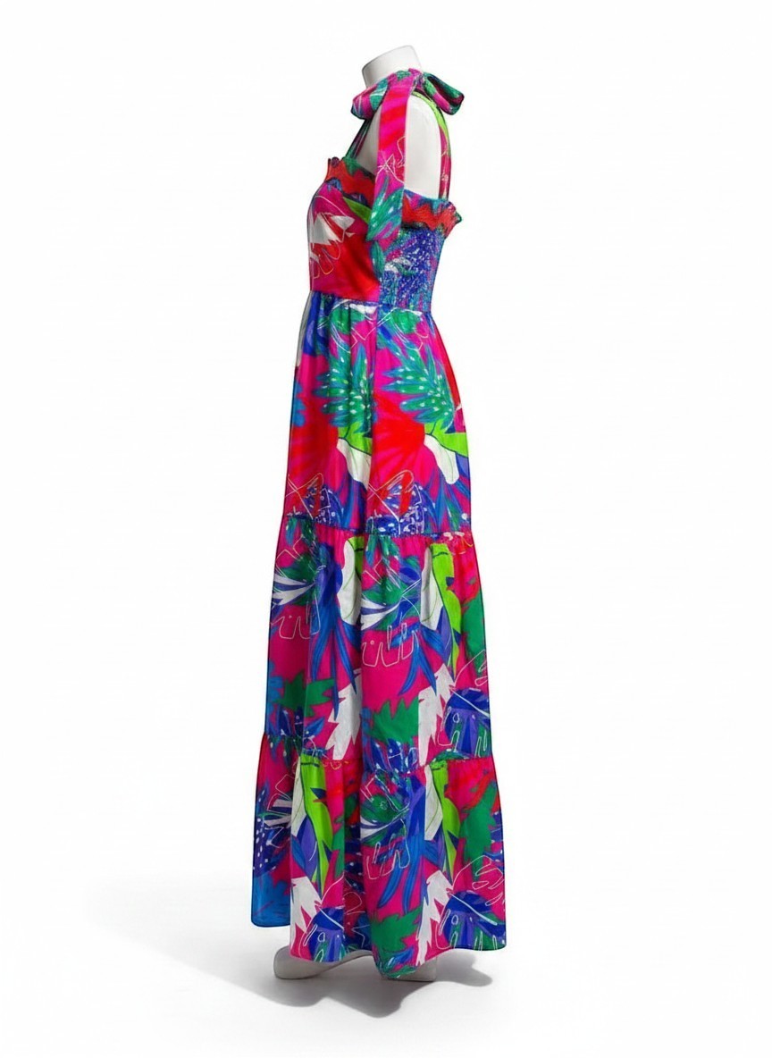 Chic Collective pink tiered maxi dress with tropical leaf print, smocked bodice, and tie-shoulder straps.