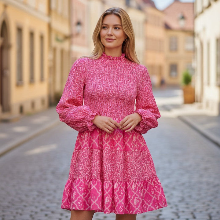 Chic Collective pink and white smocked long-sleeve tiered mini dress with a paisley print.