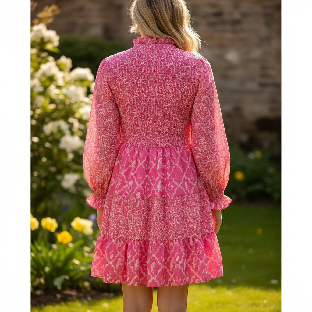 Chic Collective pink and white patterned smocked bodice tiered mini dress with long puff sleeves.