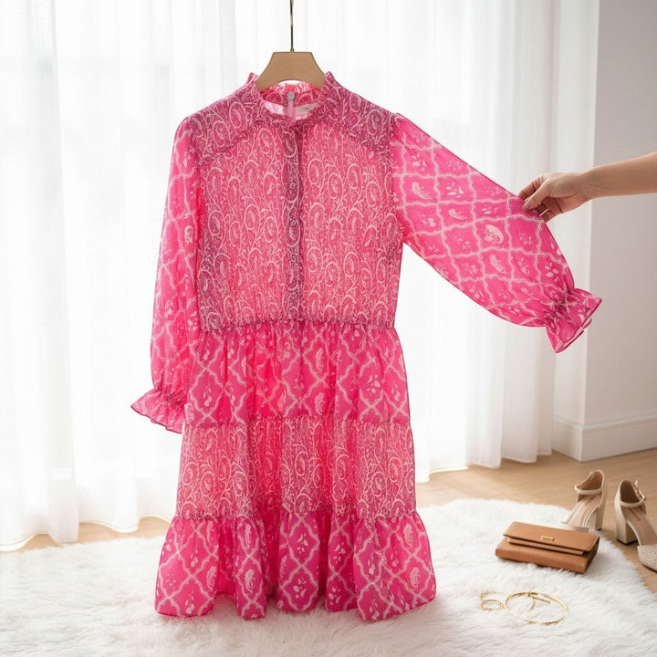 Chic Collective pink and white patterned tiered mini dress with long sleeves and a ruffled hem.