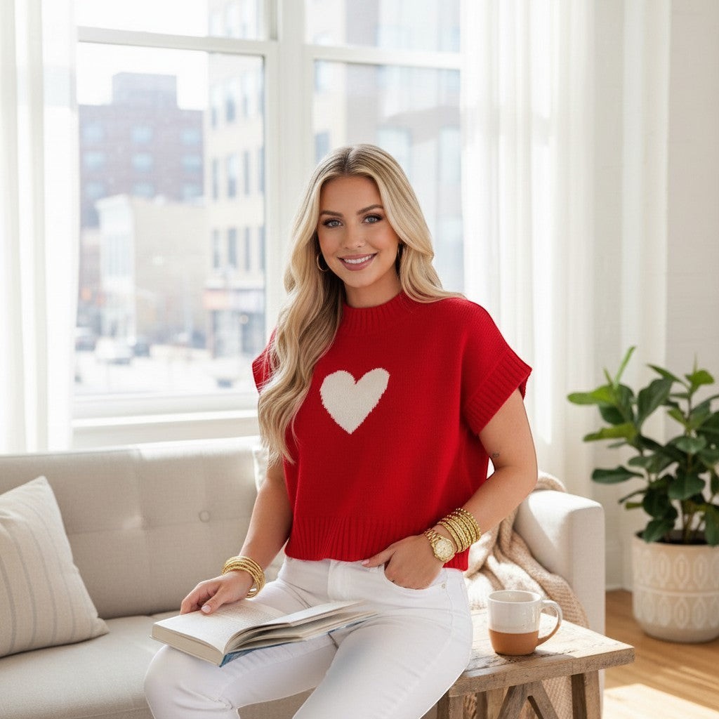 Chic Collective red knit sweater with white heart detail, short sleeves, crew neck. Model wearing size L.