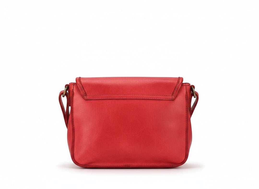Chic Collective Ruthie red Italian leather crossbody bag with adjustable strap, front buckle, and zippered pockets.