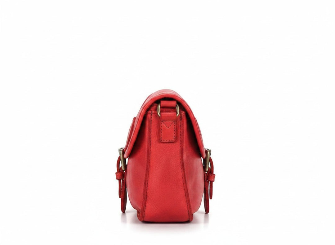 Chic Collective Ruthie red Italian leather crossbody bag with adjustable strap and buckle detail.