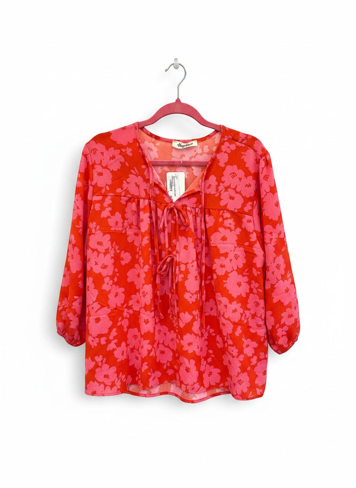 Chic Collective red and pink floral print tie-neck blouse with 3/4 sleeves and V-neckline.