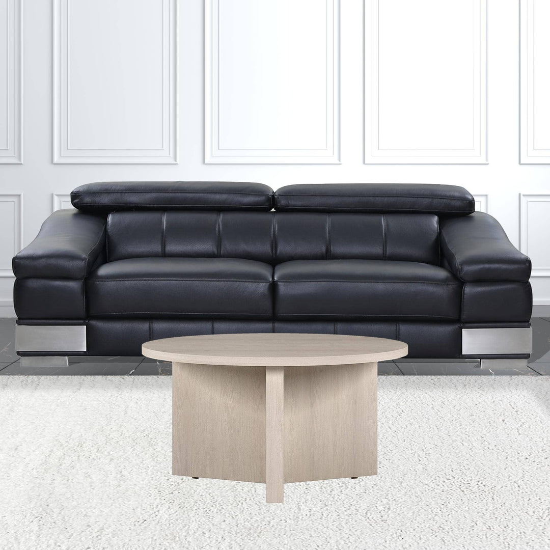 Chic Collective 32-inch round light wood coffee table with a minimalist design, perfect for living rooms.
