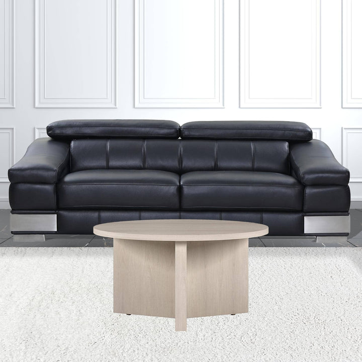 Chic Collective 32-inch round light wood coffee table with a minimalist design, perfect for living rooms.